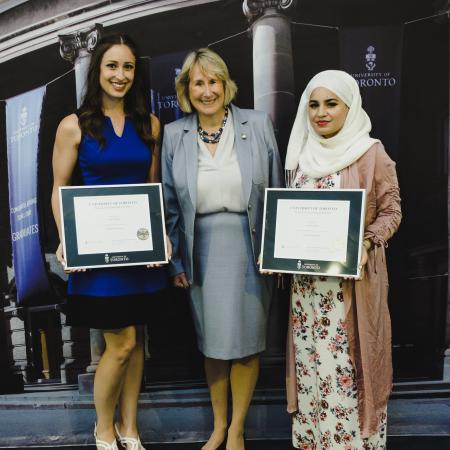 Maureen McDonald standing with two female graduates at SCS Celebrates grad ceremony