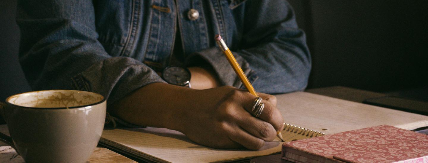 Person writing in a notebook